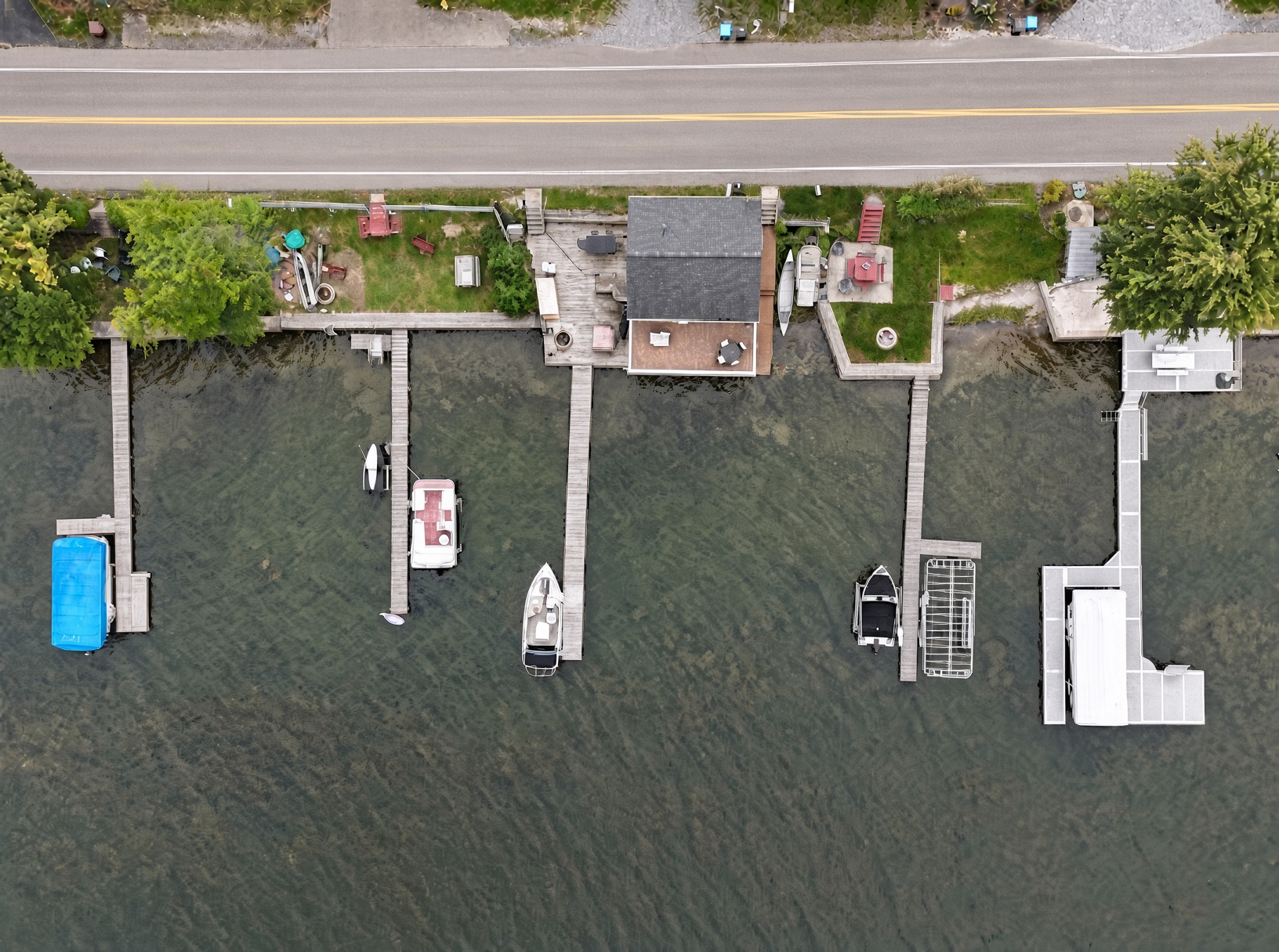 Aerial view of the waterfront, dock and Conesus Lake